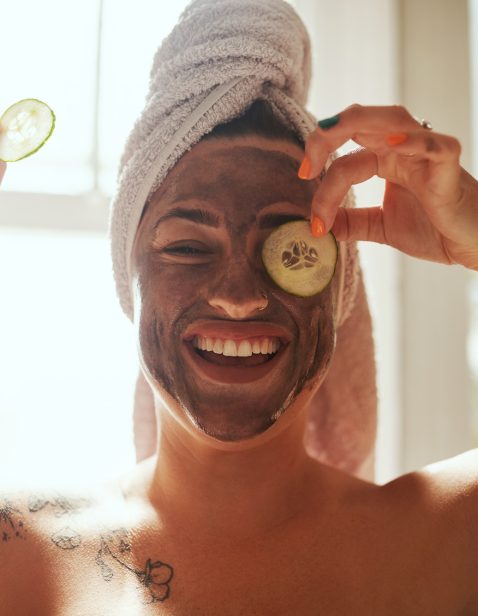Do the right thing for your skin. Shot of a young woman giving herself a facial at home.
